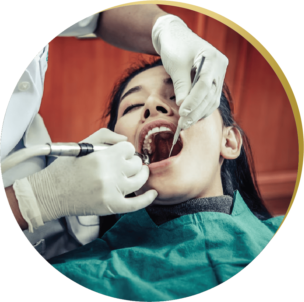 Patient undergoing a dental procedure – A dentist performing a dental implant procedure for a patient.