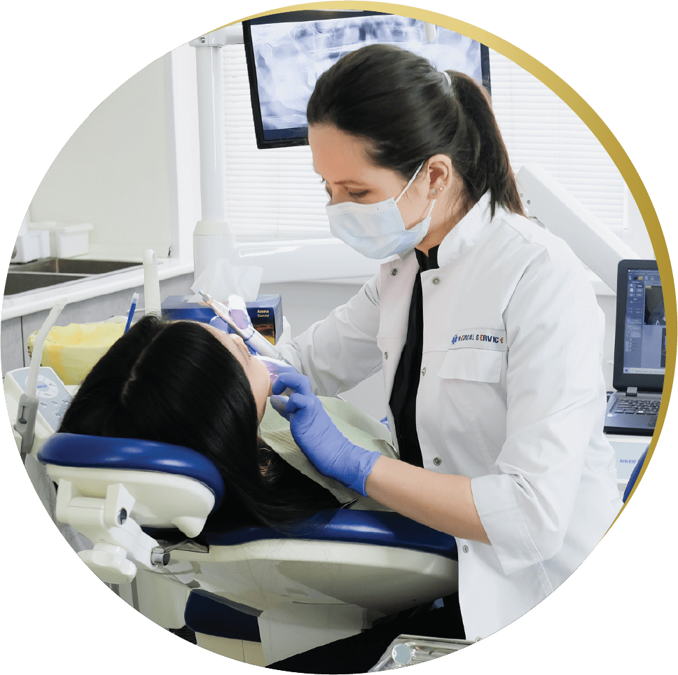 Dentist performing a cosmetic dentistry procedure on a patient at Dental Enhanced in Las Vegas